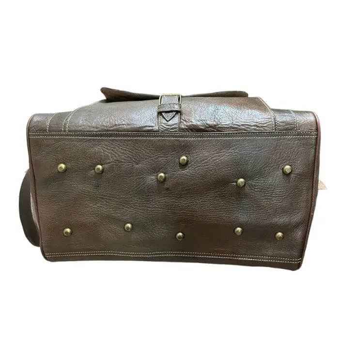 Bolso baúl gira mediano, hecho con piel natural