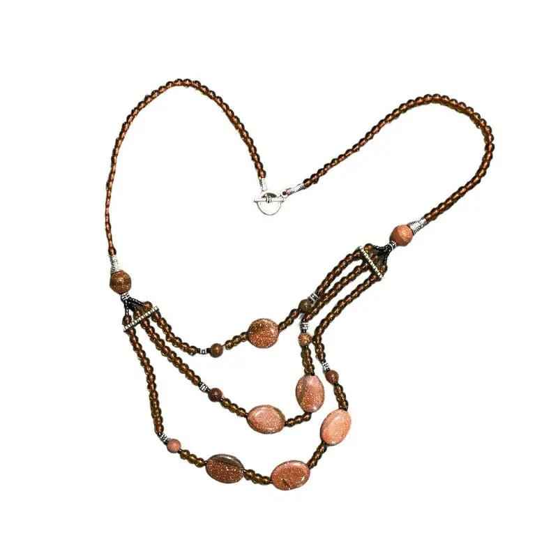 Colgante artesanal  hecho con piedra del sol para mujer